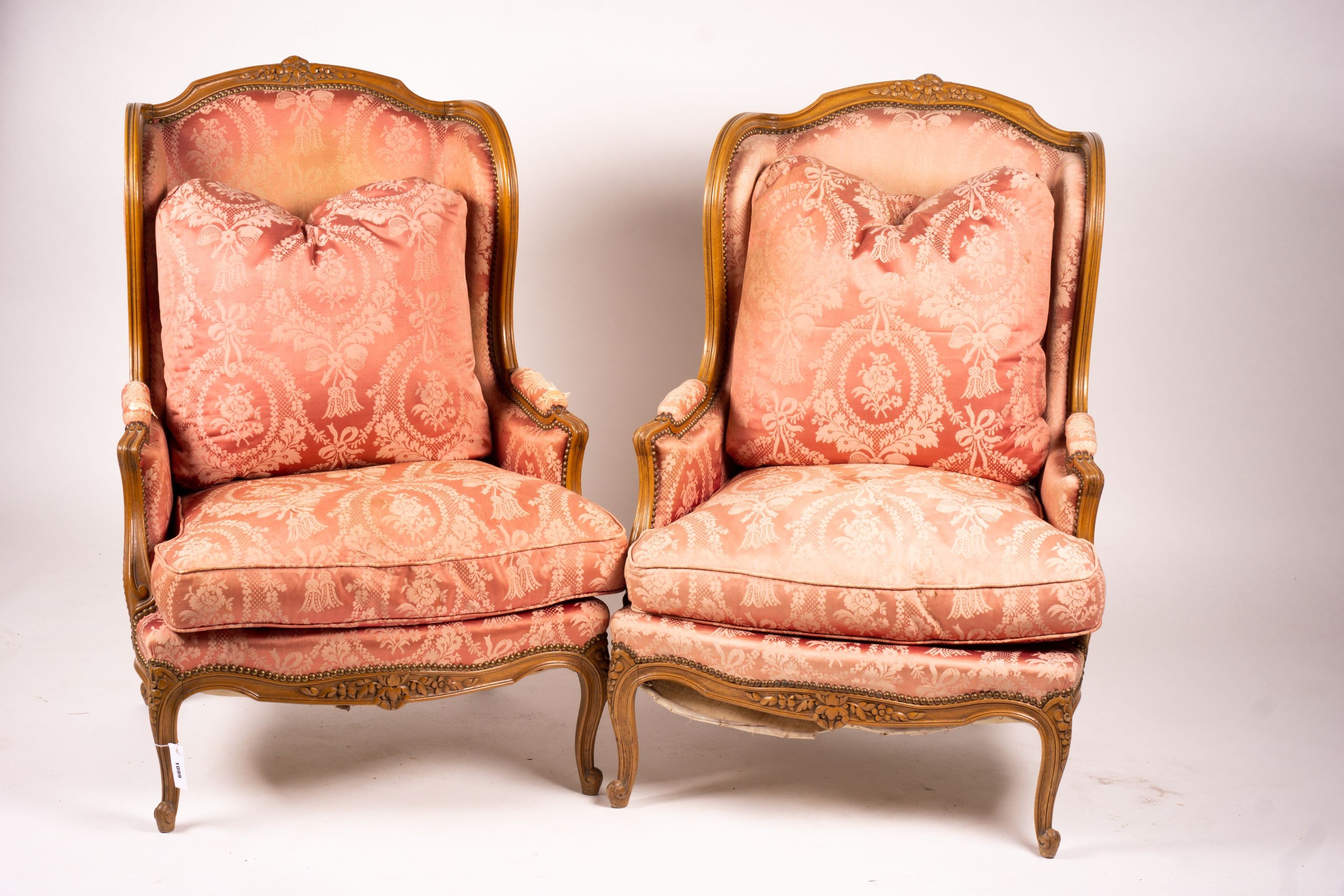 A pair of early 20th century French carved beech armchairs, width 75cm, depth 78cm, height 110cm